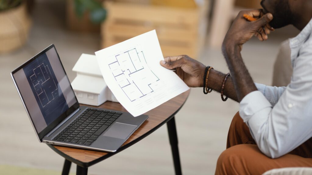 side view man making plans redecorate household